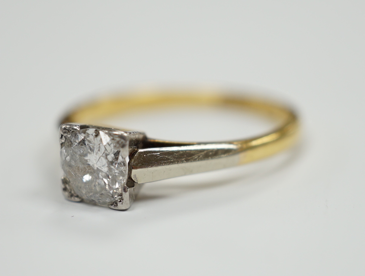 An 18ct, plat. and solitaire diamond ring, size O, gross weight 2.7 grams, the stone measuring 5.7mm in diameter.